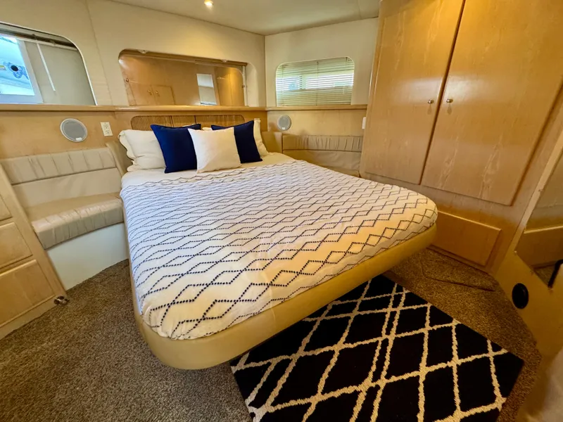 Slide: The Image of Luxurious bedroom in 1997 Carver 405 Aft Cabin Motoryacht with cozy bed and stylish decor. - 31