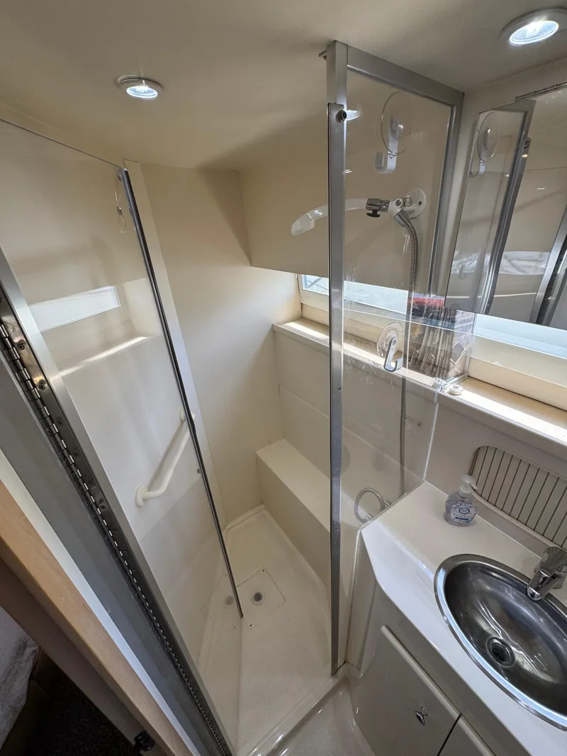 Slide: The Image of 1997 Carver 405 Aft Cabin Motoryacht bathroom with shower and sink. - 37