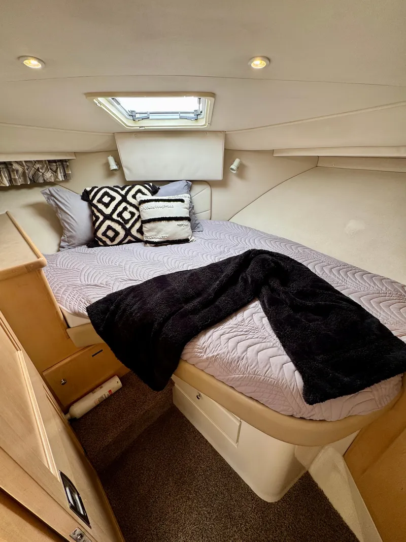 Slide: The Image of Cozy bedroom in 1997 Carver 405 Aft Cabin Motoryacht with stylish bedding and natural light. - 38