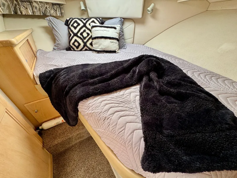 Slide: The Image of Cozy cabin bed in 1997 Carver 405 Aft Cabin Motoryacht with plush pillows and blanket. - 39