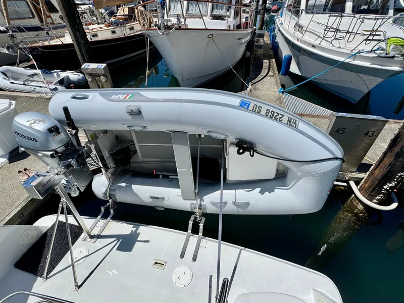 Slide: The Image of 1997 Carver 405 Aft Cabin Motoryacht with inflatable dinghy and Honda outboard motor. - 4