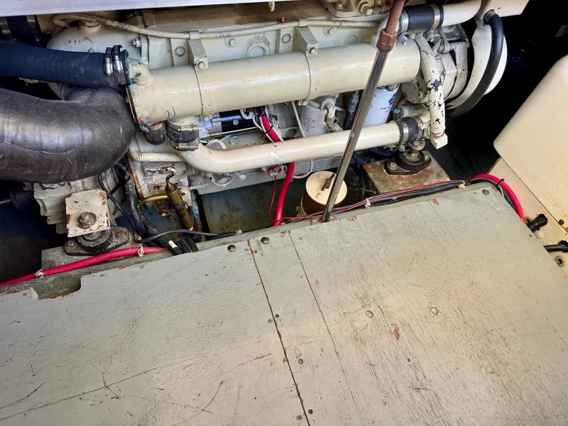 Slide: The Image of Engine compartment of a 1997 Carver 405 Aft Cabin Motoryacht, showing mechanical components. - 44