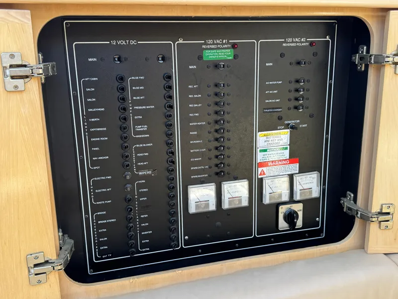 Slide: The Image of Electrical panel of 1997 Carver 405 Aft Cabin Motoryacht with various switches and indicators. - 45
