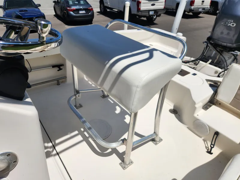 Slide: The Image of 2009 Pioneer 220 Bay Sport boat interior with seating and steering wheel. - 12