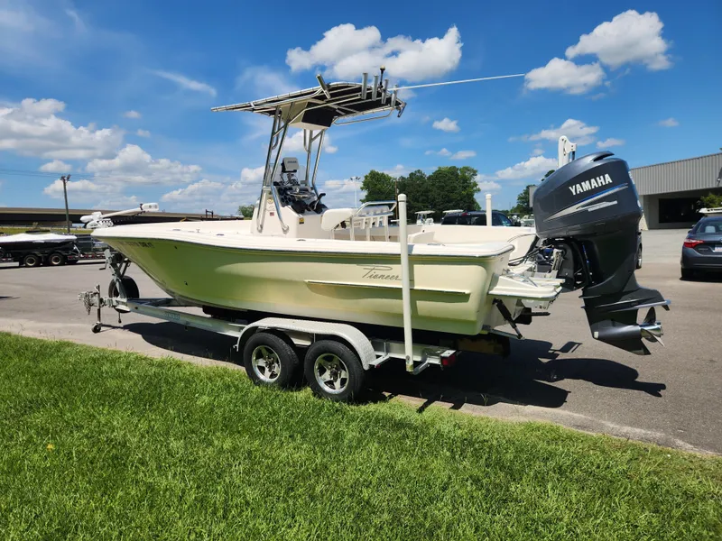 Slide: The Image of 2009 Pioneer 220 Bay Sport boat with Yamaha engine on trailer, parked outdoors. - 5