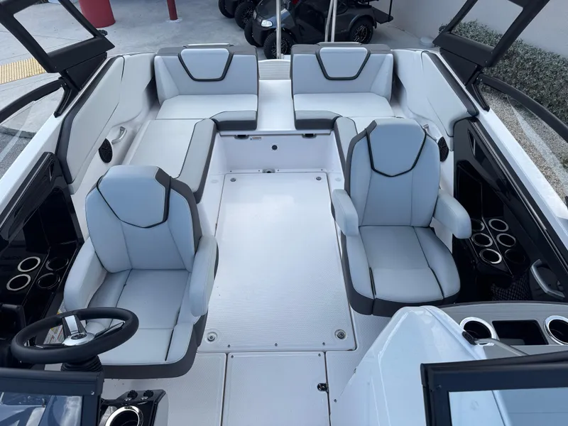 Slide: The Image of 2025 Yamaha Boats AR250 interior with modern seating and sleek design. - 11
