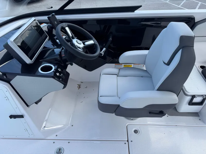 Slide: The Image of 2025 Yamaha Boats AR250 cockpit with modern steering and comfortable seating. - 17