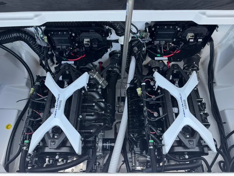 Slide: The Image of 2025 Yamaha AR250 boat engine compartment with dual high-output engines. - 21