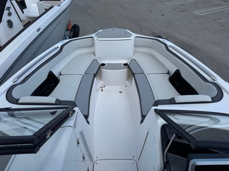 Slide: The Image of 2025 Yamaha Boats AR250 interior with spacious seating and modern design. - 5