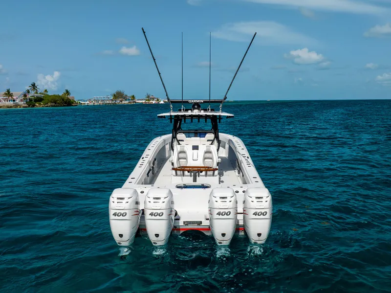 Slide: The Image of 2022 Freeman 37 VH boat with four engines on clear blue water. - 18