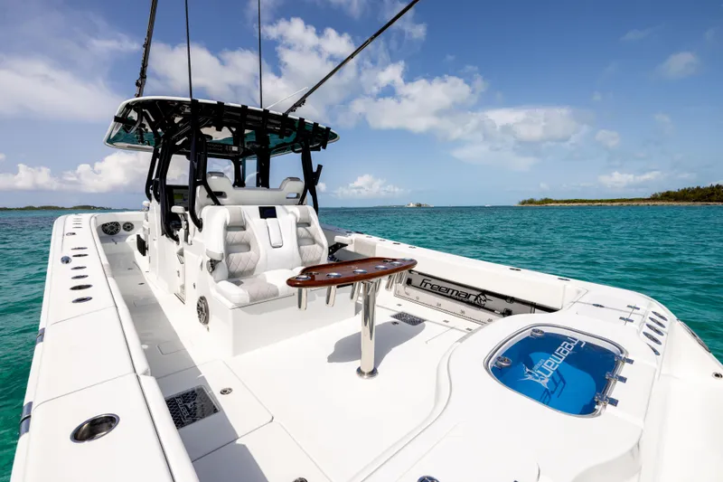 Slide: The Image of Freeman 37 VH 2022 boat on turquoise water, featuring sleek design and comfortable seating. - 22