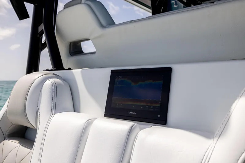 Slide: The Image of Freeman 37 VH 2022 boat interior with Garmin display on white seating. - 33