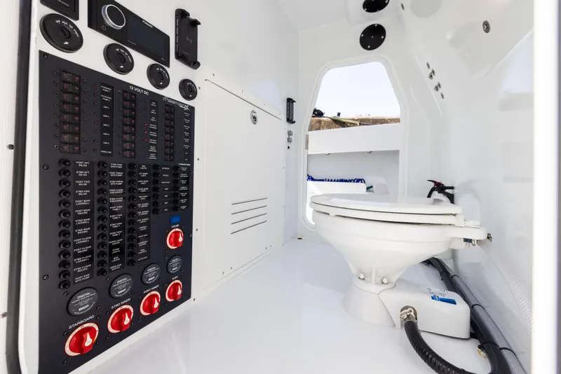 Slide: The Image of Freeman 37 VH 2022 boat interior with control panel and toilet. - 49
