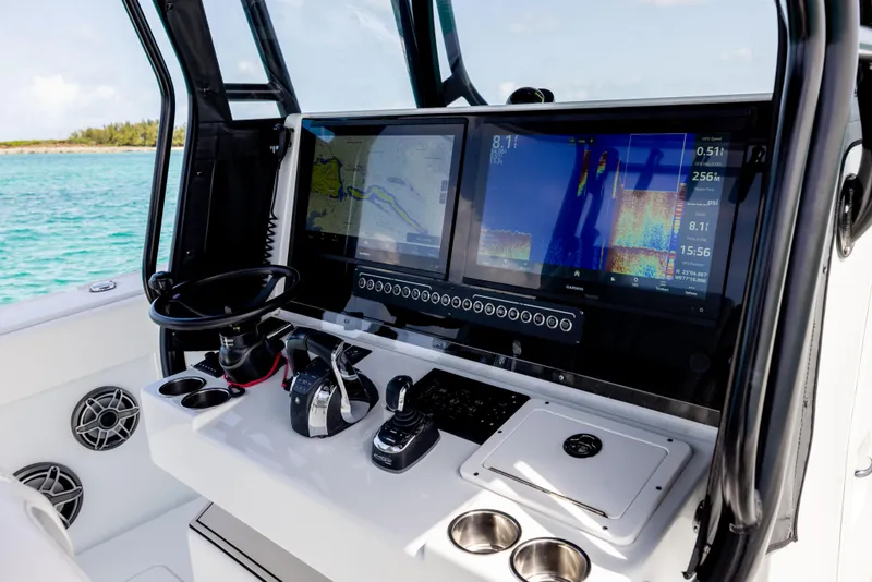 Slide: The Image of Freeman 37 VH 2022 boat dashboard with navigation screens and controls. - 41