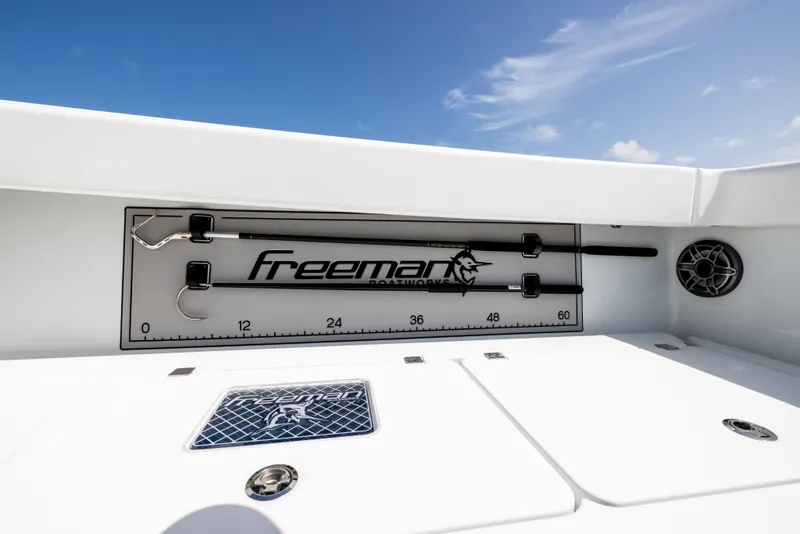 Slide: The Image of Freeman 37 VH 2022 boat interior with fishing rod holder and measurement scale. - 31