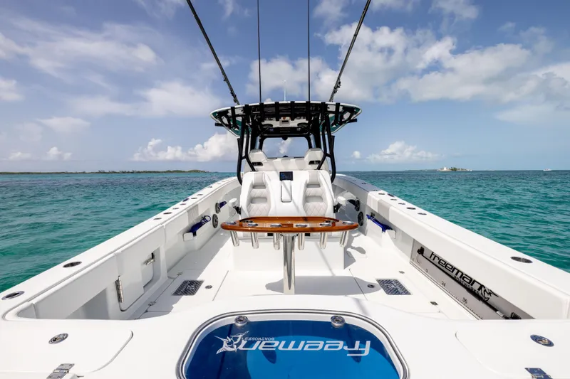 Slide: The Image of Freeman 37 VH 2022 boat on turquoise water, featuring sleek design and comfortable seating. - 20