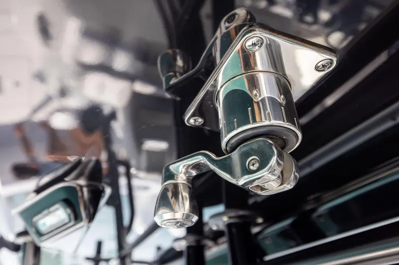 Slide: The Image of Close-up of a chrome latch mechanism on a 2022 Freeman 37 VH boat. - 45