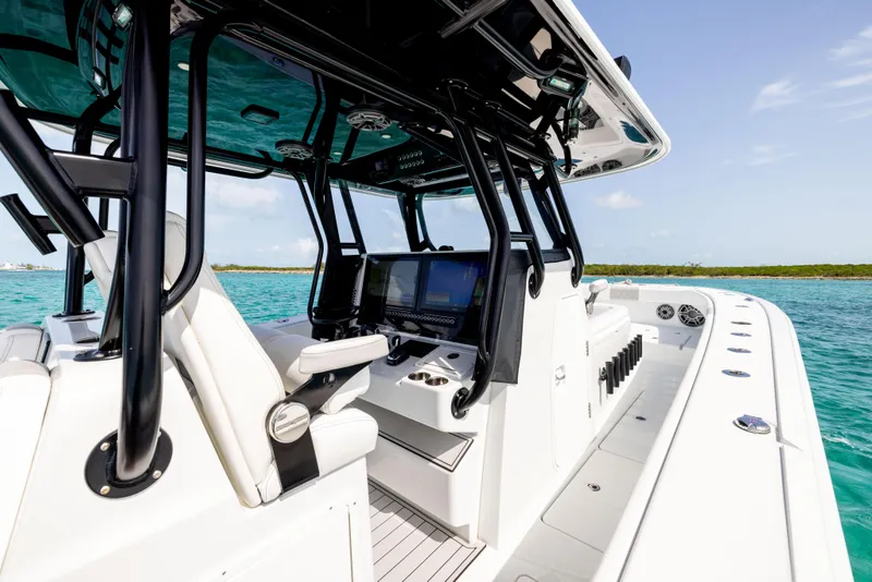 Slide: The Image of 2022 Freeman 37 VH boat interior with advanced navigation system on turquoise water. - 38