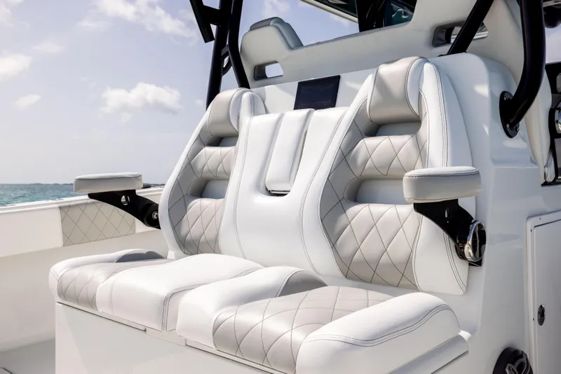 Slide: The Image of Luxurious seating on 2022 Freeman 37 VH boat, featuring diamond-stitched upholstery and armrests. - 32