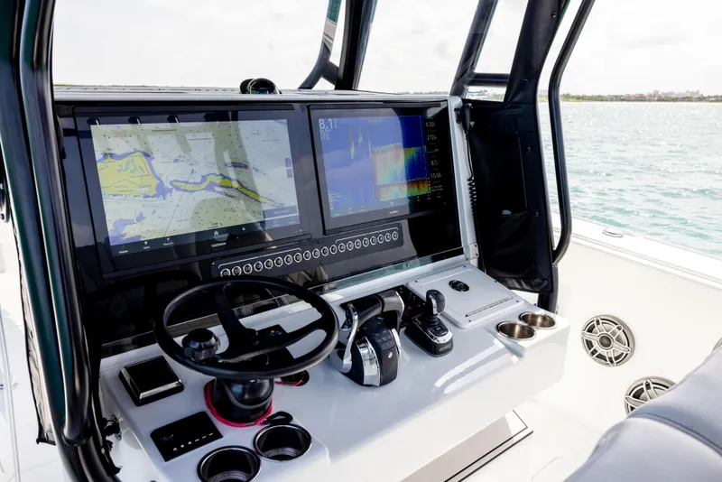 Slide: The Image of Cockpit of 2022 Freeman 37 VH boat with advanced navigation displays and controls. - 48