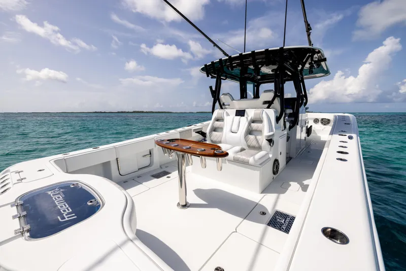 Slide: The Image of 2022 Freeman 37 VH boat on clear ocean water under a blue sky. - 21