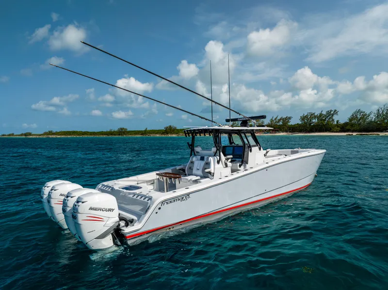 Slide: The Image of 2022 Freeman 37 VH boat on clear blue water with Mercury engines. - 17