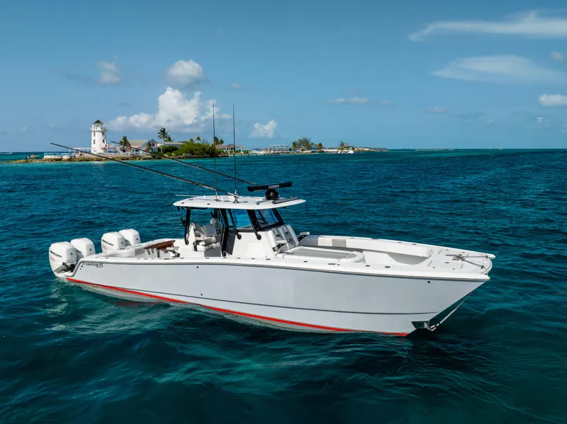 Slide: The Image of 2022 Freeman 37 VH boat on blue ocean near island with lighthouse. - 14