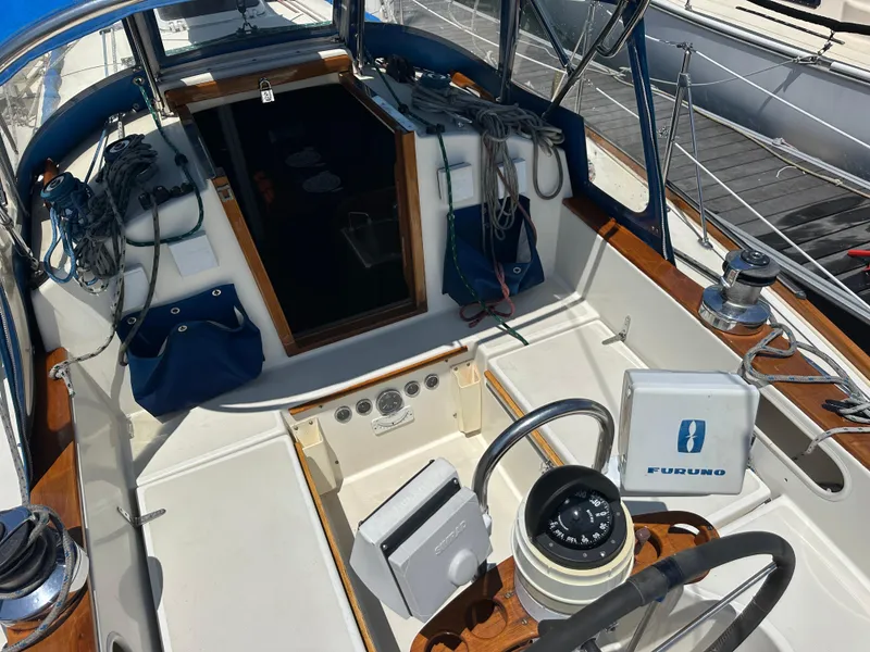 Slide: The Image of Cockpit of 1985 Sabre 34 MKI sailboat with navigation equipment and steering wheel. - 10