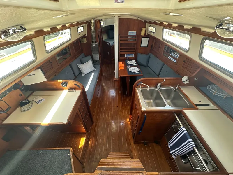 Slide: The Image of Interior of 1985 Sabre 34 MKI sailboat with wood finish and cozy seating area. - 14