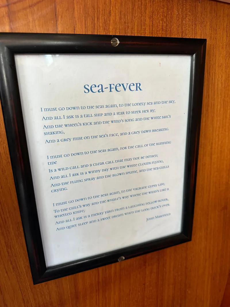 Slide: The Image of Framed "Sea-Fever" poem on Sabre 34 MKI sailboat, 1985 model, wooden background. - 30