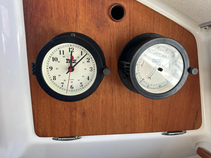 Slide: The Image of Clock and barometer on 1985 Sabre 34 MKI wooden panel. - 34