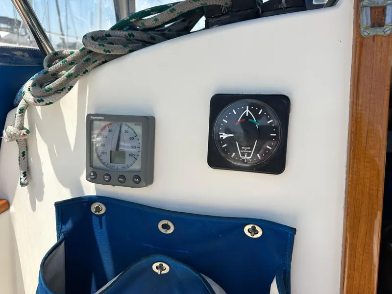 Slide: The Image of Control panel of a 1985 Sabre 34 MKI sailboat with gauges and rope. - 49
