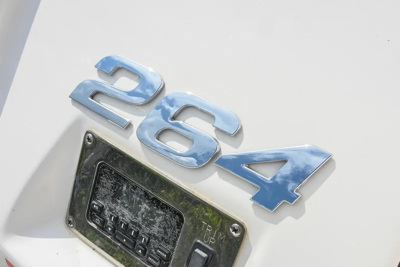 Slide: The Image of Chrome "264" emblem on 2018 Chaparral 264 Sunesta boat. - 10