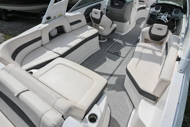 Slide: The Image of 2018 Chaparral 264 Sunesta boat interior with spacious seating and modern dashboard. - 14