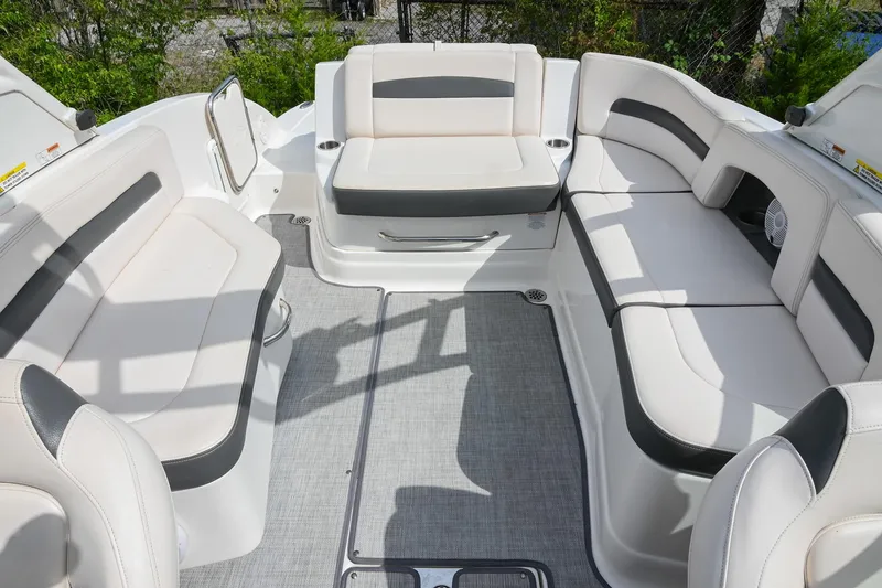 Slide: The Image of 2018 Chaparral 264 Sunesta boat interior with spacious seating and modern design. - 15