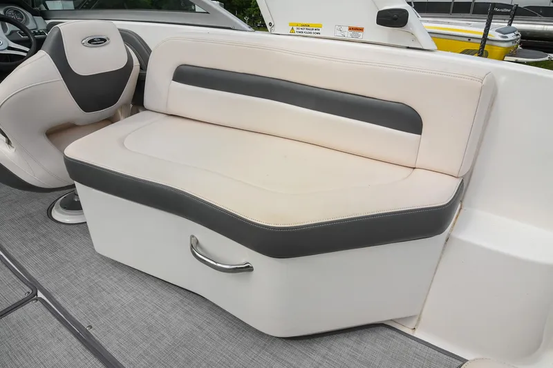 Slide: The Image of 2018 Chaparral 264 Sunesta boat interior seating with gray and white upholstery. - 19