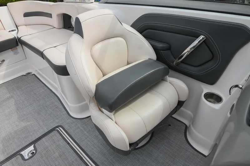 Slide: The Image of 2018 Chaparral 264 Sunesta boat interior with plush seating and modern design. - 23