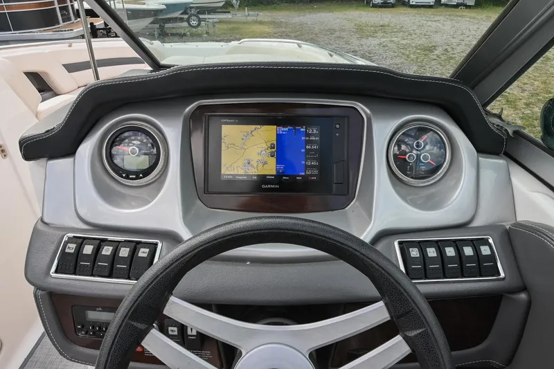 Slide: The Image of Dashboard of 2018 Chaparral 264 Sunesta boat with Garmin GPS and control switches. - 26
