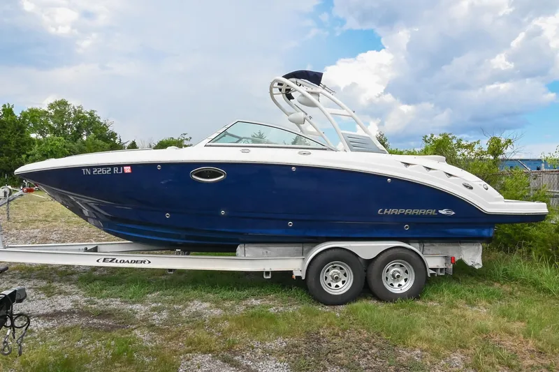 Slide: The Image of 2018 Chaparral 264 Sunesta boat on trailer, parked outdoors. - 3