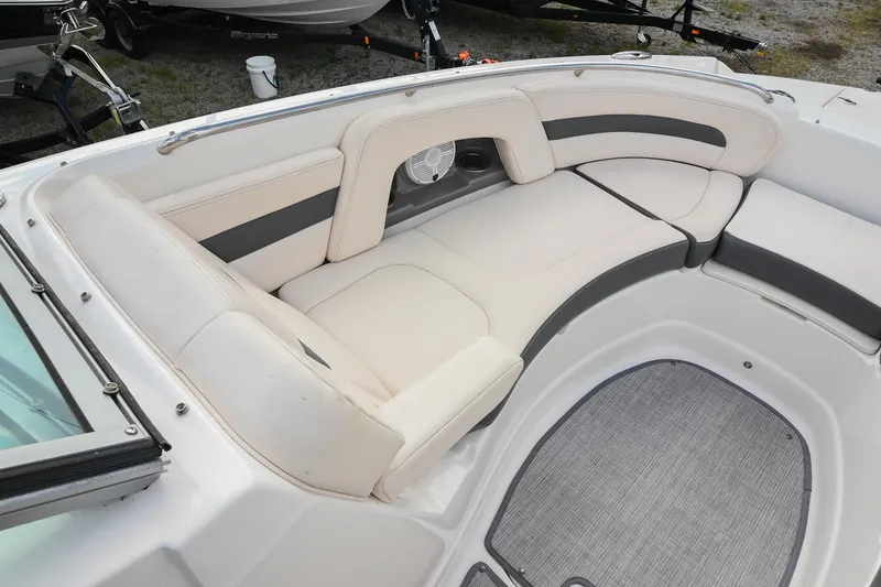 Slide: The Image of 2018 Chaparral 264 Sunesta boat interior with plush seating and modern design. - 30