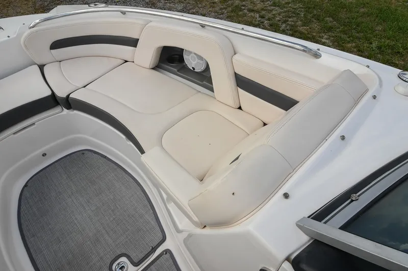 Slide: The Image of 2018 Chaparral 264 Sunesta boat interior with cushioned seating and speaker. - 32