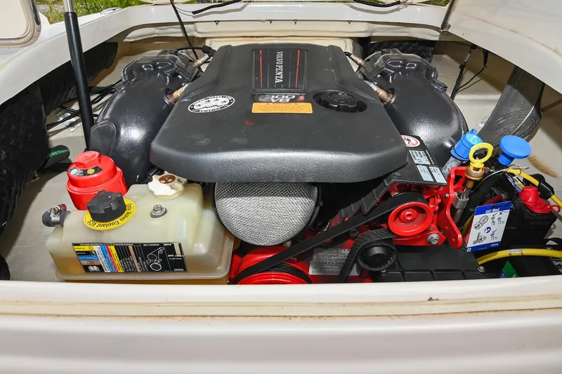 Slide: The Image of Engine compartment of 2018 Chaparral 264 Sunesta boat, showcasing detailed components and layout. - 35