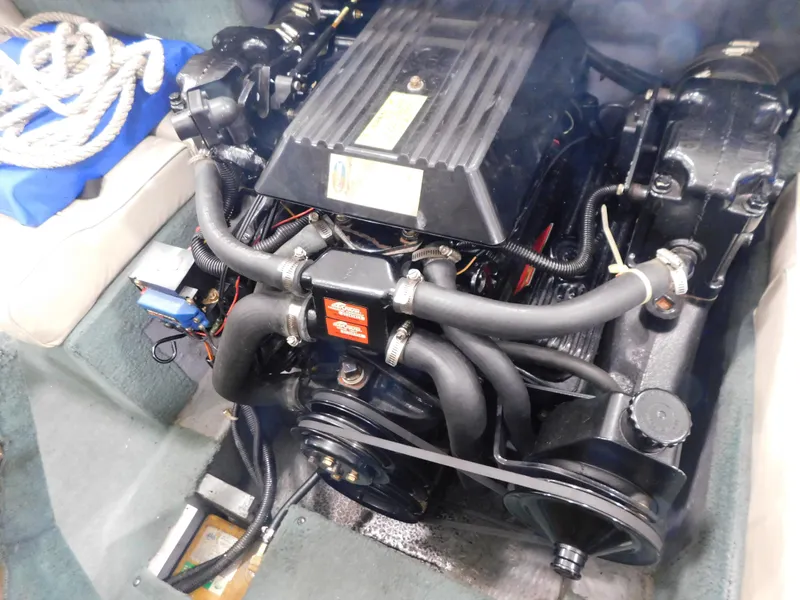 Slide: The Image of Engine of a 1989 Sea Ray 20 CUDDY boat, featuring hoses and components. - 10