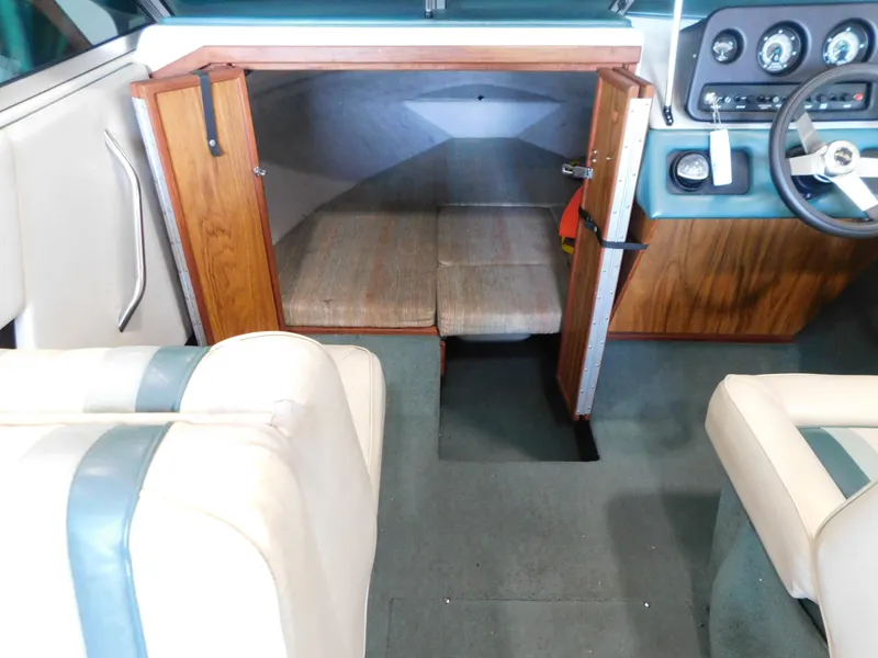Slide: The Image of 1989 Sea Ray 20 CUDDY interior with cabin, steering wheel, and seating. - 7