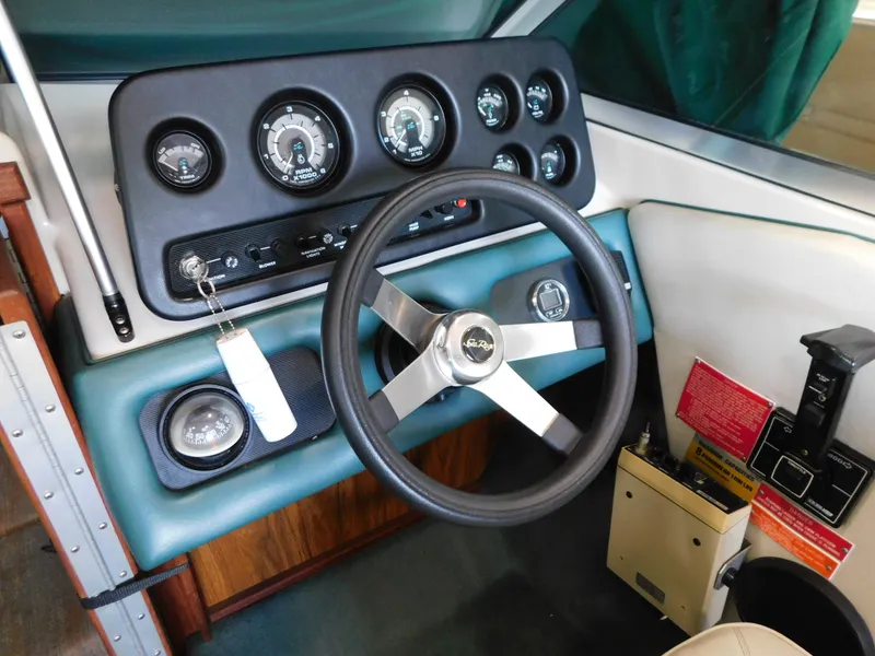 Slide: The Image of 1989 Sea Ray 20 CUDDY dashboard with steering wheel and instrument panel. - 9