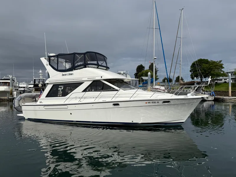 Slide: The Image of 2001 Bayliner 3988 Command Bridge Motoryacht docked in a marina. - 1