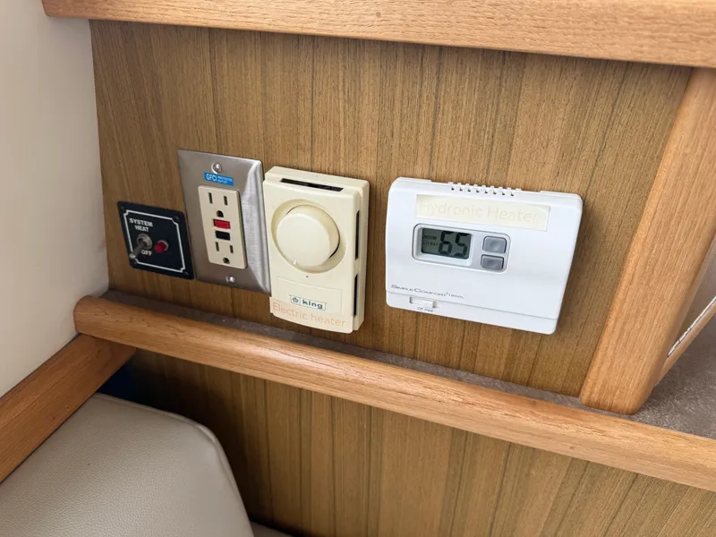 Slide: The Image of Control panel on 2001 Bayliner 3988 Command Bridge Motoryacht with heater and thermostat. - 13