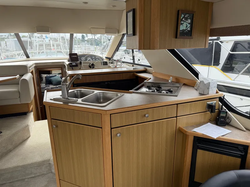 Slide: The Image of Interior of 2001 Bayliner 3988 Command Bridge Motoryacht with kitchen and helm. - 17