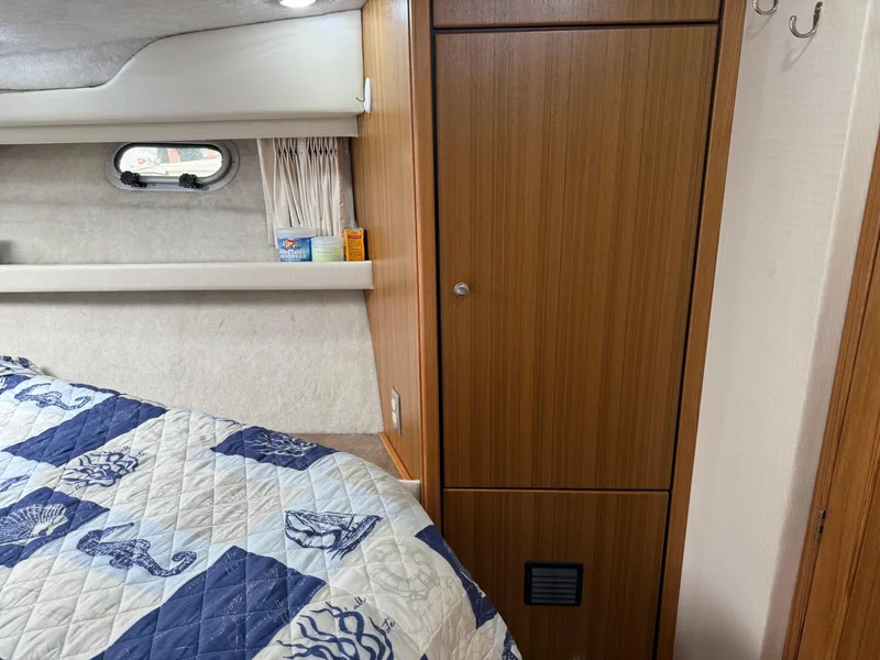 Slide: The Image of Interior cabin of 2001 Bayliner 3988 Command Bridge Motoryacht with nautical-themed bedding. - 32