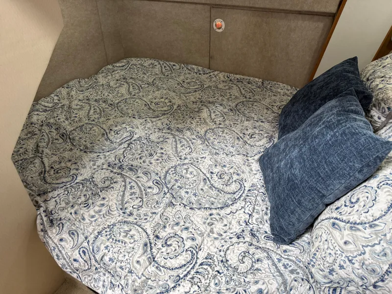 Slide: The Image of Cozy bed with paisley bedding in 2001 Bayliner 3988 Command Bridge Motoryacht cabin. - 38